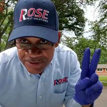 rose technician giving peace sign